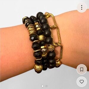 Bundle of black and gold beaded stretch bracelets